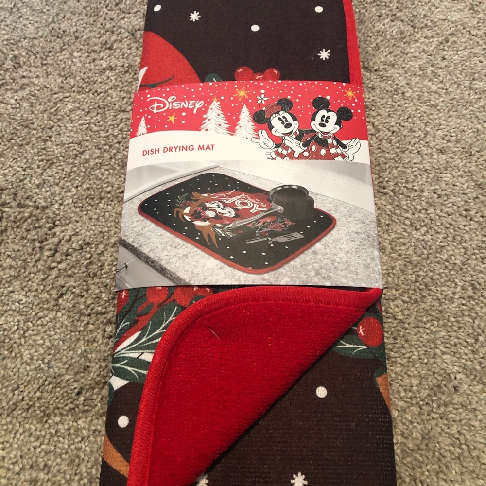 Disney dish drying mat and measuring spoons.